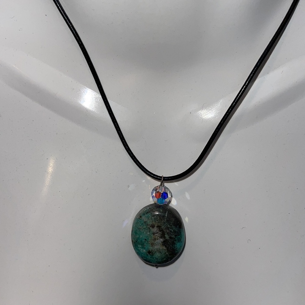 NWOT Turquoise stone necklace with 16” leather cord and silver clasp